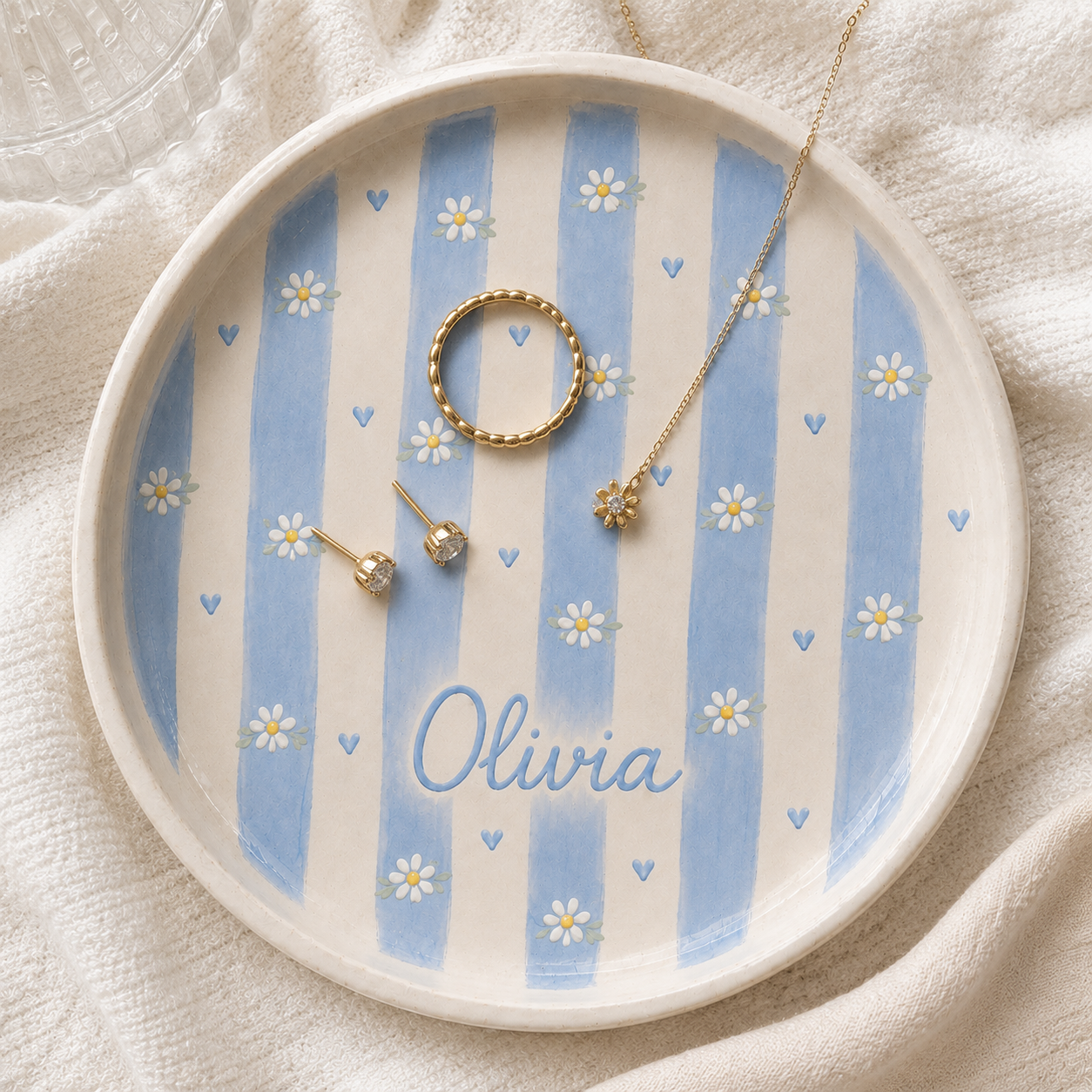 Blue personalized daisy ceramic trinket dish with Olivia name and gold jewelry