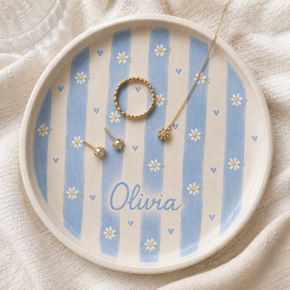 Blue personalized daisy ceramic trinket dish with Olivia name and gold jewelry