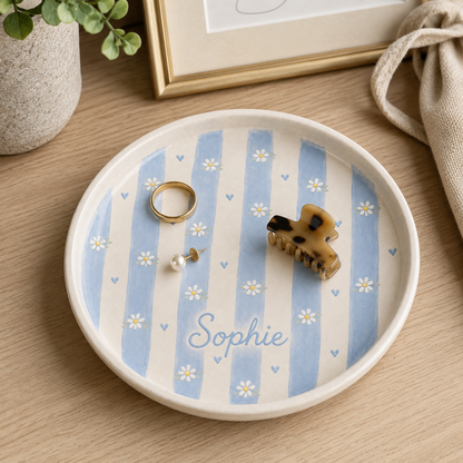 Blue personalized daisy ceramic trinket dish styled as jewelry holder with Sophie name