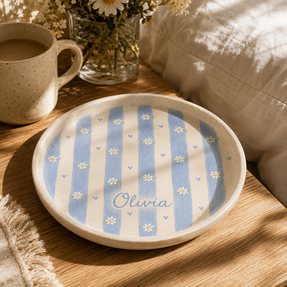Blue striped personalized daisy ceramic trinket dish styled with coffee and Olivia name