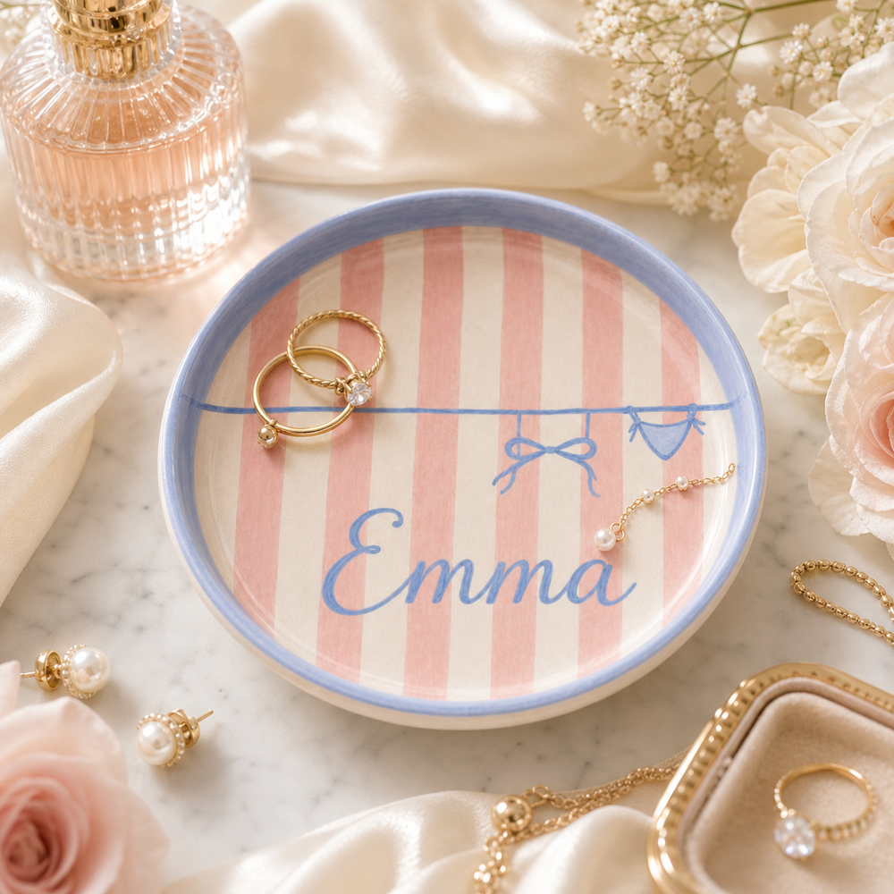 Personalized ceramic trinket dish styled with jewelry and soft flowers