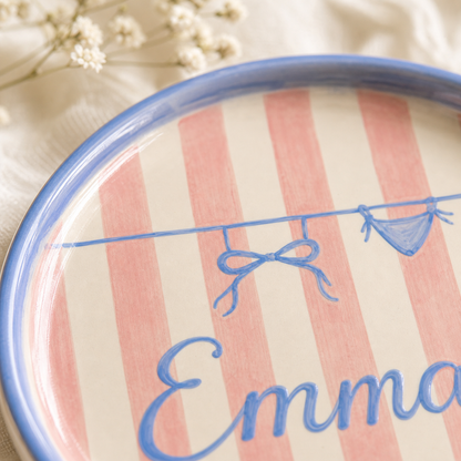 Close up of hand painted ceramic trinket dish bow and Emma lettering