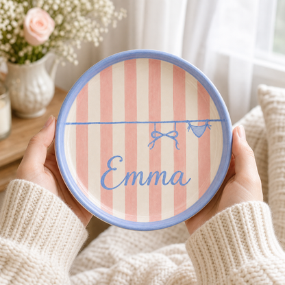 Personalized ceramic trinket dish held in hands with Emma name