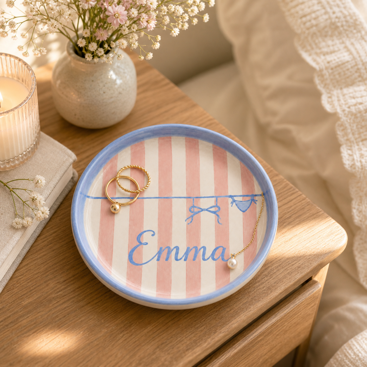 Personalized ceramic trinket dish on bedside table with jewelry