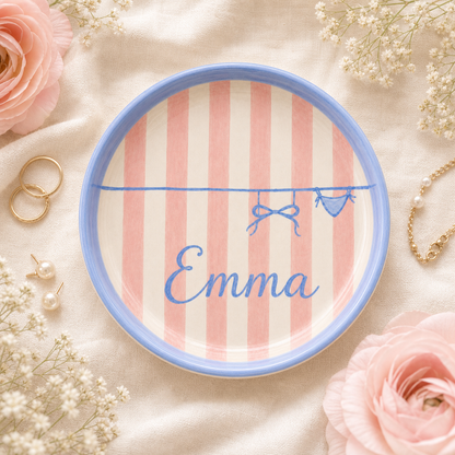 Flat lay personalized ceramic trinket dish with rings and flowers