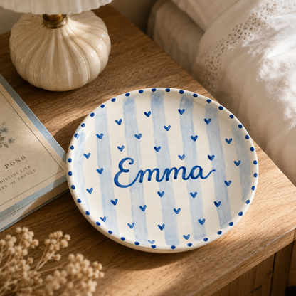 Blue heart personalized ceramic plate on bedside table