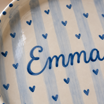 Close up of blue hand-painted name plate lettering and hearts
